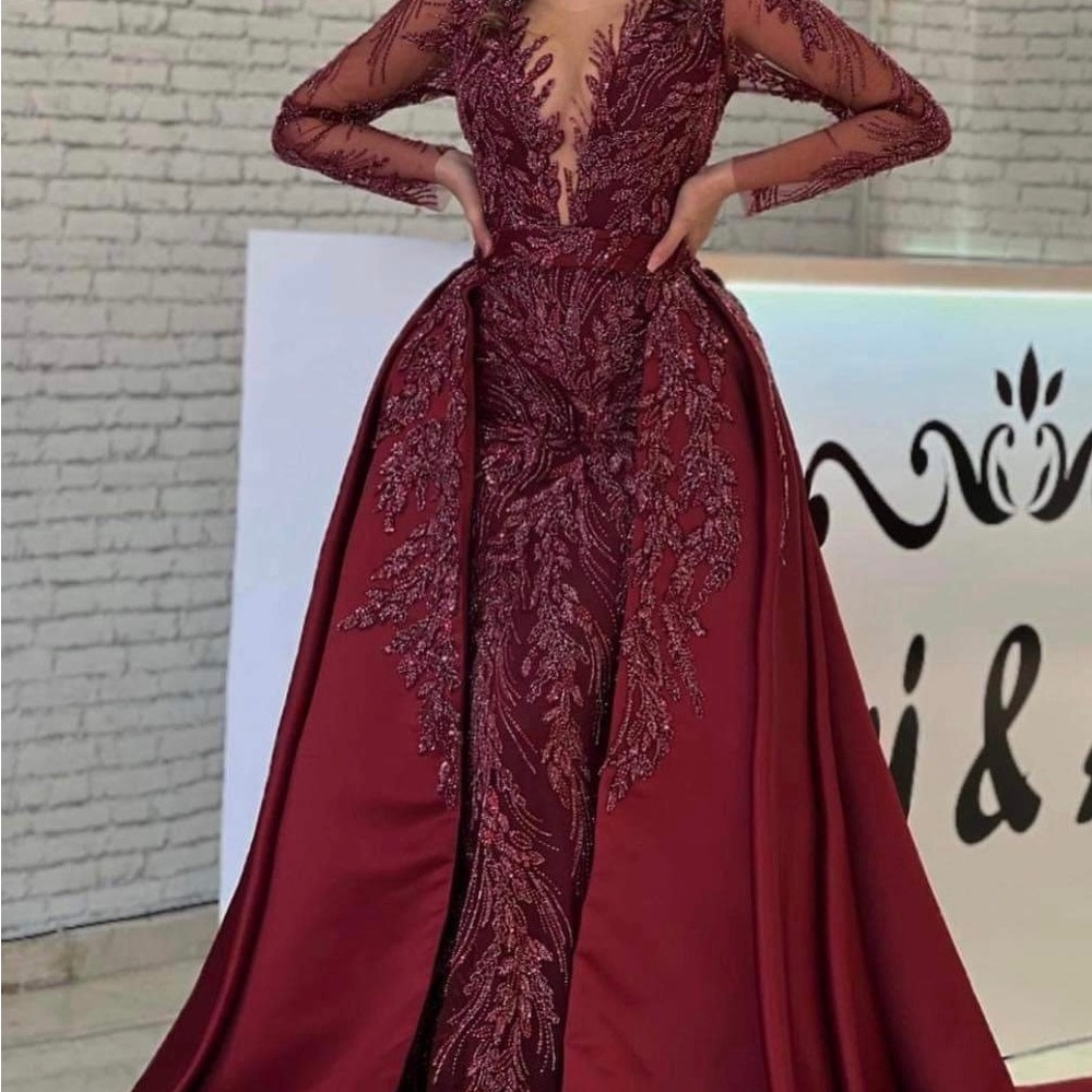 Beautiful burgundy beaded ball gown with detachable over skirt.
